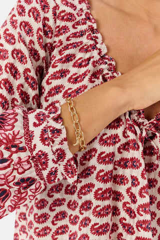 MADISON 501 Oval Link Bracelet Chain, a gold-tone oval link chain bracelet featuring a small heart charm and a lobster claw clasp.