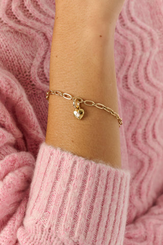 MADISON 501 Gem Heart Charm featuring a gold heart-shaped charm with a small, pear-shaped clear stone at the center and a circular jump ring at the top.
