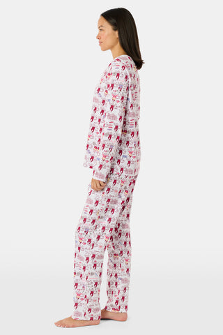 The Alpha Phi Monkey Pajamas by Roller Rabbit are a long-sleeve pajama set crafted from soft Pima cotton, featuring a red and gray cartoon animal print on a white background, with a Henley top and matching pants.