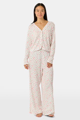 Wearing the Roller Rabbit Mini Monkey Blossom Pointelle Monroe Pant, a person stands barefoot against a plain white background.