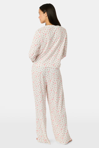 Wearing the Roller Rabbit Mini Monkey Blossom Pointelle Monroe Pant, a person stands barefoot against a plain white background.