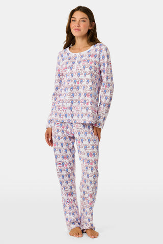 The Roller Rabbit Pi Beta Phi Monkey Pajamas are a long-sleeve set featuring a Henley top and pants, both adorned with a repeating red and blue monkey print on a white background. Made from soft Pima cotton, these pajamas are lightweight and comfortable.