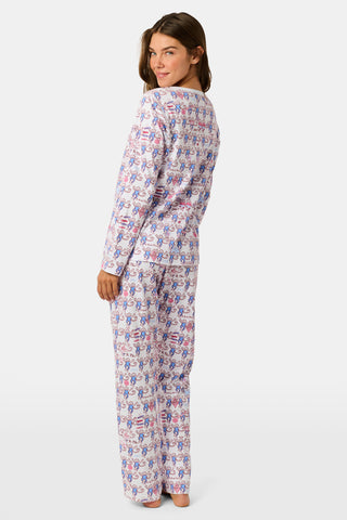 The Roller Rabbit Pi Beta Phi Monkey Pajamas are a long-sleeve set featuring a Henley top and pants, both adorned with a repeating red and blue monkey print on a white background. Made from soft Pima cotton, these pajamas are lightweight and comfortable.