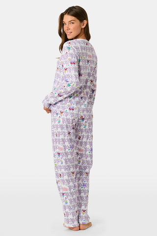 The Sigma Kappa Monkey Pajamas by Roller Rabbit is a long-sleeve set featuring a buttoned top and comfortable elastic waist, decorated with an all-over pattern of colorful cartoon monkey faces on a white background.