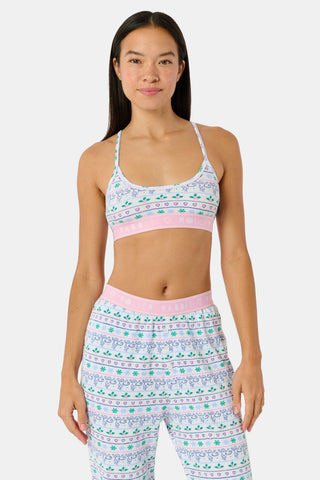 A Snowday Stripe Sarah Scoop Bralette featuring a print of monkeys, holly, and hearts, with a pink elastic band labeled RABBIT HEART ROLLER.