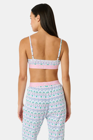 A Snowday Stripe Sarah Scoop Bralette featuring a print of monkeys, holly, and hearts, with a pink elastic band labeled RABBIT HEART ROLLER.
