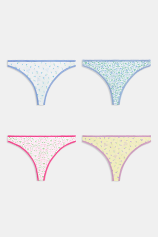 The Roller Rabbit Ditsy Florals Thong 4 Pack features four pairs of women’s thong underwear in pastel blue, green, pink, and yellow floral patterns. Crafted from soft cotton modal for all-day comfort and displayed on a light background.