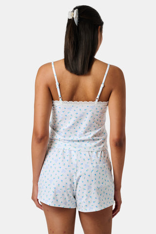 Introducing the Roller Rabbit Mini Monkey Blossom Jones Shortie, a white boxer short featuring a playful pattern of small blue and green turtles and rabbits. Crafted from soft cotton modal for a gentle feel and relaxed fit, this short is showcased against a simple light background.
