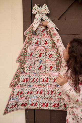 SAPPHIRE Holly Berry Advent Calendar: a tree-shaped 100 cotton calendar with numbered pockets from 1 to 24 and red embroidery.
