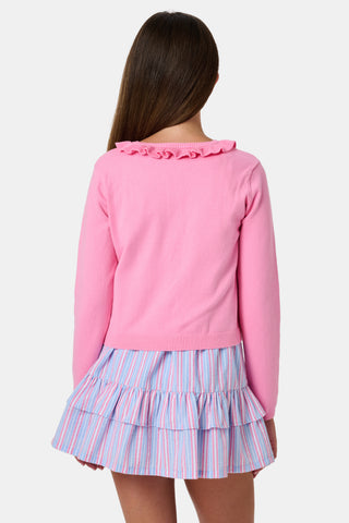 The Kids Ellis Cardigan by Roller Rabbit is a rose pink, long-sleeve cardigan featuring a ruffled collar and pearl-like buttons. Shown flat on a white background, it's made from soft cotton sweater material.