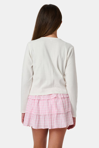 The Roller Rabbit Kids Hearts Pointelle Heidi Cardigan features a white long-sleeve design with playful pink heart details, reminiscent of a classic button-up style, and is displayed against a plain white background.