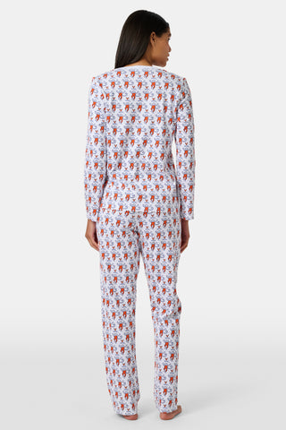 A woman stands barefoot wearing the SERFLEX UVA Lovely Monkey Pajamas—a matching long-sleeved top and pants set crafted from soft Pima cotton, featuring a playful red and white cartoon monkey print on a plain white background. These cozy UVA PJs are perfect dorm essentials for relaxing in comfort.