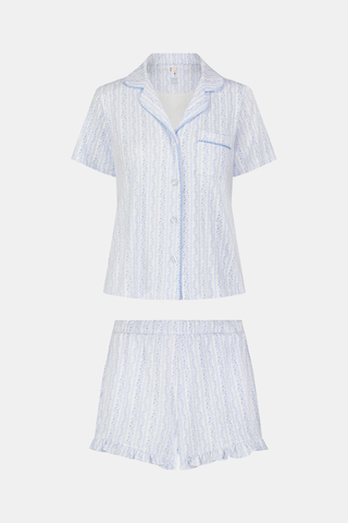 The Hearts Vine Wyatt Polo Pajamas by Roller Rabbit are a two-piece set with a short-sleeve, button-up collared shirt and matching shorts in soft Pima Cotton, featuring a light blue and white stripe and delicate Hearts Vine print.