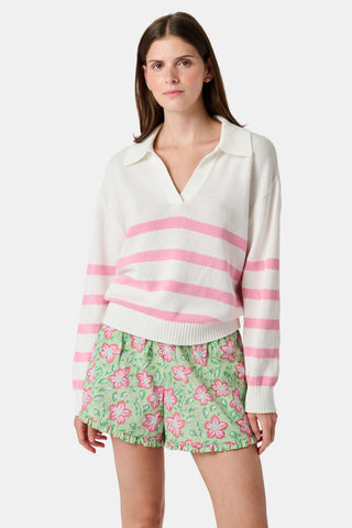 The Roller Rabbit Striped Rocio Sweater is a white long-sleeve cotton sweater with light pink horizontal stripes, featuring a wide collared V-neck and ribbed hem and cuffs. The sweater is shown against a plain white background.