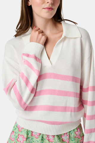 The Roller Rabbit Striped Rocio Sweater is a white long-sleeve cotton sweater with light pink horizontal stripes, featuring a wide collared V-neck and ribbed hem and cuffs. The sweater is shown against a plain white background.