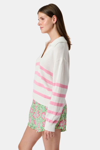 The Roller Rabbit Striped Rocio Sweater is a white long-sleeve cotton sweater with light pink horizontal stripes, featuring a wide collared V-neck and ribbed hem and cuffs. The sweater is shown against a plain white background.