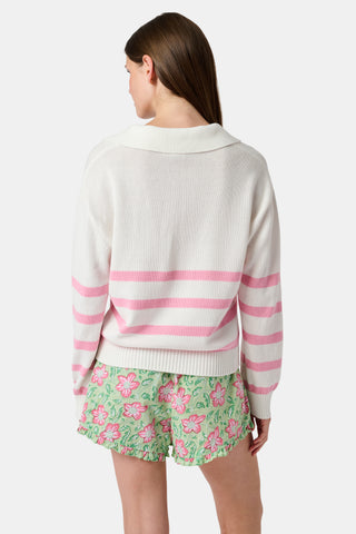 The Roller Rabbit Striped Rocio Sweater is a white long-sleeve cotton sweater with light pink horizontal stripes, featuring a wide collared V-neck and ribbed hem and cuffs. The sweater is shown against a plain white background.