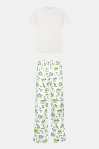 The Roller Rabbit Mens Game, Set, Monkey Troy Pajamas feature a white short-sleeve t-shirt paired with white pajama pants decorated with a vibrant dinosaur and jungle print in green, blue, and black. This playful Pima cotton loungewear set from Roller Rabbit is displayed on a plain white background.