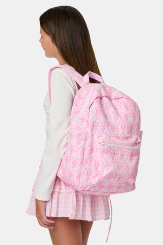 Introducing the Lovely Monkey Backpack by Roller Rabbit, showcasing a charming pattern of playful pink monkeys on a light pink background. Crafted from durable polyester, this backpack features a front zipper pocket, side pockets, and a top handle—all coordinated in matching pink hues.