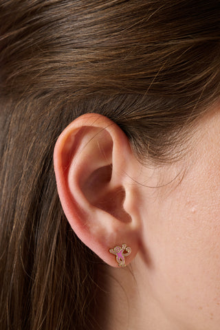 Eight pairs of playful stud earrings—including pink monkeys, gold horseshoes, gold eggs, gold whales, and pink elephants—make up the Icon Party Earring Pack by Roller Rabbit. Perfect for customizing your earscape, each pair is presented on a white card decorated with signature brand icons.
