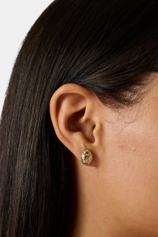 Eight pairs of playful stud earrings—including pink monkeys, gold horseshoes, gold eggs, gold whales, and pink elephants—make up the Icon Party Earring Pack by Roller Rabbit. Perfect for customizing your earscape, each pair is presented on a white card decorated with signature brand icons.
