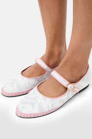 The FLABELUS Camellia Block Mary Jane is a flat linen shoe with a pink floral block print, pink trim, a buckle strap, and black sole, shown against a white background.