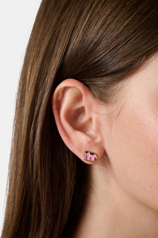 Eight pairs of playful stud earrings—including pink monkeys, gold horseshoes, gold eggs, gold whales, and pink elephants—make up the Icon Party Earring Pack by Roller Rabbit. Perfect for customizing your earscape, each pair is presented on a white card decorated with signature brand icons.