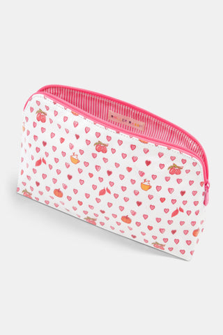 The Autumn Hearts Makeup Bag by Roller Rabbit is a white cotton canvas pouch featuring a pink zipper, adorned with pink hearts and playful illustrations of fruit baskets and apples scattered throughout the design.