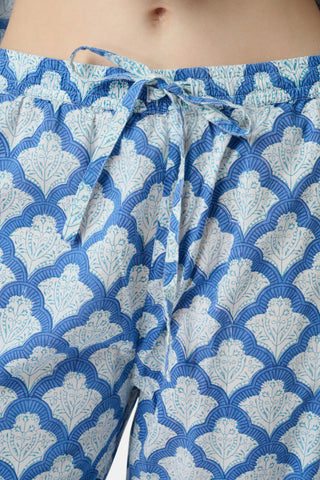 The Jemina Lulu Set features a repeating blue and white scallop pattern filled with delicate floral and leaf motifs, creating a textured effect reminiscent of traditional Jemina blue print—perfect for cozy PJ or short sets.