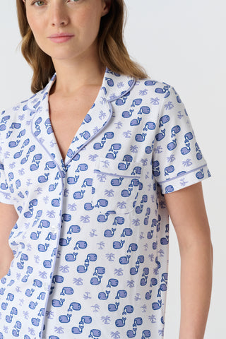 The Mens Moby Simon Pant features a playful print of blue whales and light purple octopuses scattered on white pima cotton, with the whales facing different directions.