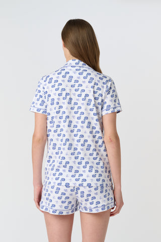 The Mens Moby Simon Pant features a playful print of blue whales and light purple octopuses scattered on white pima cotton, with the whales facing different directions.