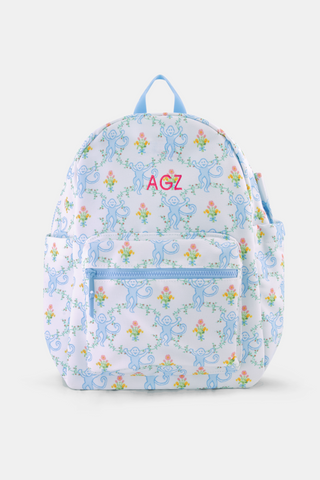 The Roller Rabbit Floral Monkey Trellis Backpack is a white diaper bag with pastel blue zipper and handle, blue monkey and floral pattern, side pockets, and a front zip pocket.