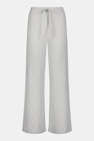 A person wearing the Roller Rabbit Cable Knots Olivia Pant in light gray, featuring a drawstring waist, paired with a matching top and white sneakers. The photo is cropped from shoulders down against a white background.