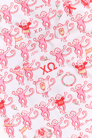 The Roller Rabbit Chi Omega Monkey Pajamas are a long-sleeve Henley top pajama set with matching pants, featuring a white background decorated with red, pink, and gray hearts, XOXO motifs, and playful accents. The pants are designed with a comfortable mid-rise elastic waist.