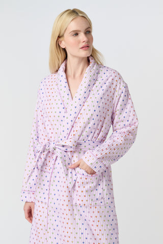 A woman stands barefoot in the Roller Rabbit Disco Hearts Cosmo Robe, featuring a subtle geometric pattern and a matching waist tie, facing forward against a plain white background.