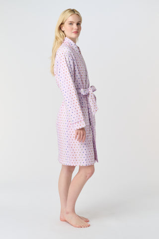 A woman stands barefoot in the Roller Rabbit Disco Hearts Cosmo Robe, featuring a subtle geometric pattern and a matching waist tie, facing forward against a plain white background.