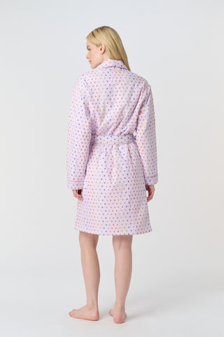 A woman stands barefoot in the Roller Rabbit Disco Hearts Cosmo Robe, featuring a subtle geometric pattern and a matching waist tie, facing forward against a plain white background.