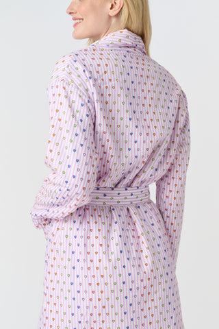 A woman stands barefoot in the Roller Rabbit Disco Hearts Cosmo Robe, featuring a subtle geometric pattern and a matching waist tie, facing forward against a plain white background.
