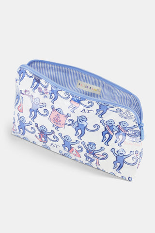 The Delta Gamma Monkey Makeup Bag by Roller Rabbit is a white zippered pouch crafted from cotton canvas, featuring cheerful blue and red monkey illustrations, Greek letters, and playful doodles. Inspired by DG themes, this makeup bag displays whimsical symbols and lively text for a fun, eye-catching pattern on the front.