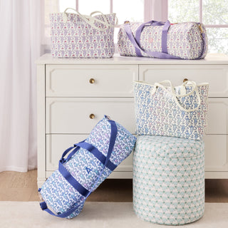 Patterned bags on a dresser with a window in the background