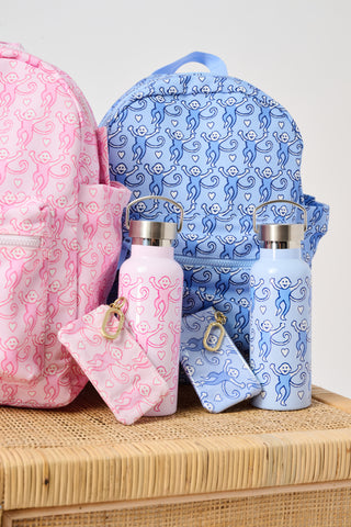 The Roller Rabbit Lovely Monkey Backpack for kids features a playful pattern of monkeys in various poses, a front pocket, and pink zippers set against a light background.