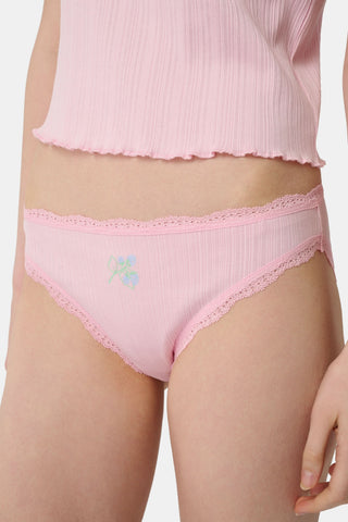 The Roller Rabbit Fruits Embroidery Bikini 4 Pack features four ribbed girls' panties—two pink, two light blue—made from soft Pima cotton with delicate lace trim and playful embroidered fruits for a retro touch.