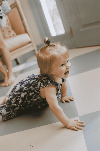 Baby in Roller Rabbit dress