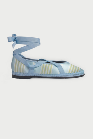 The Positano Stripe Ribbon by FLABELUS is a light blue satin ballet-inspired slipper featuring yellow and white stripes, a pointed toe, blue ankle-wrapping ribbon tie, and a woven sole with visible stitching.
