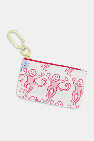 Introducing the Roller Rabbit Gamma Phi Beta Monkey Coin Pouch—a compact white zippered pouch crafted from water-resistant cotton canvas, adorned with playful pink cartoon monkeys and finished with a gold keychain clip at the corner. Designed for easy cleaning.