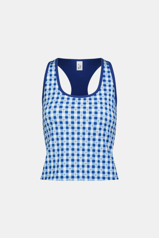A person wears the Roller Rabbit Gingham Hearts Bella Tank, a blue-and-white checkered racerback style with small heart details. The image is cropped at the shoulders and midsection, showing part of the matching skirt and the person’s head.