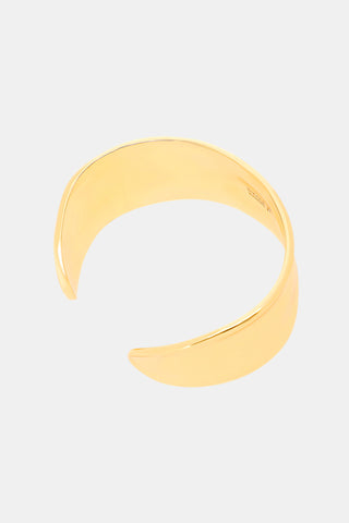 Wavy Cuff Bracelet in wide, gold-tone plated brass with an irregular, wavy edge.