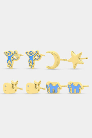 The Roller Rabbit Icon Party Earring Pack includes six pairs of charming gold stud earrings—featuring signature icons like blue monkeys, a crescent moon, a star, whales, and blue elephants—perfect for creating a custom earscape, all beautifully displayed on a plain white background.