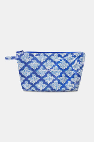The Jemina Toiletry Case by Roller Rabbit is a blue and white floral zippered pouch with a side handle, perfect for travel essentials or as a water-resistant toiletry case. Shown on a plain light background.