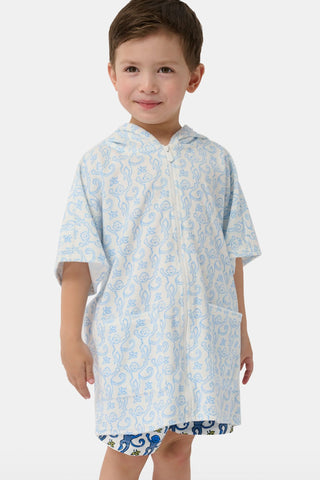 Child wearing a light blue patterned hooded towel on a white background